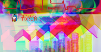 Grafika z pieniędzmi i nieruchomościami, w tle panorama Torunia